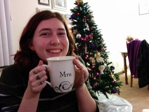 Me and our tree with the hot chocolate my husband made me~